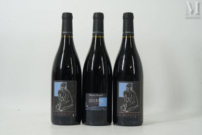 three bottles of wine sitting next to each other on a table
