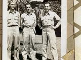 an old photo of three men in military uniforms standing next to each other
