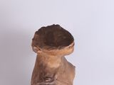 sculpture of a woman holding a bowl on her head