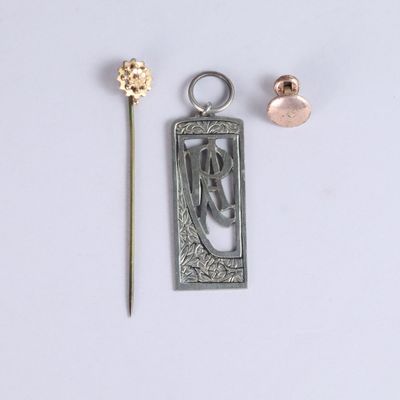 a close up of a metal object with a flower on it