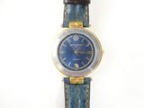 an image of a close up of a wrist watch on a white surface