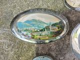 a plate with a picture of a town on it