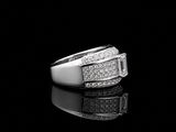 an image of a diamond ring on a black surface