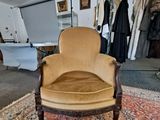 a chair that is sitting in a room with a rug