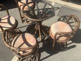 four chairs and a table in a parking lot