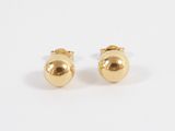 a pair of gold earrings on a white background
