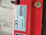 a close up of a red fire hydrant with a barcode on it