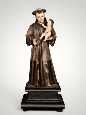 a statue of a man holding a baby in his arms