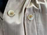 a close up of a shirt with buttons on it