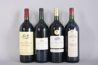 three bottles of red wine are lined up on a table