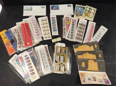 a lot of stamps and envelopes on the table