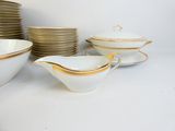 a lot of dishes that are sitting on a table