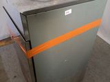an image of a small refrigerator with a cord on it