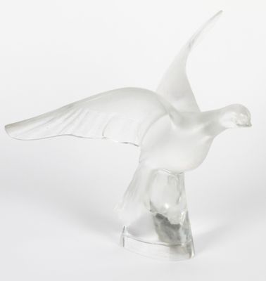 an image of a glass bird sculpture on a white background