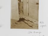 an old photo of a picture of a person standing in a doorway