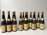 several bottles of wine are lined up on a table