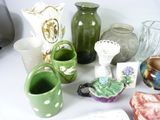 many different types of vases and bowls on the table