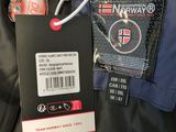 a tag attached to the back of a jacket that has a tag attached to it