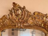 a mirror that is sitting on the wall in the room