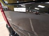 a close up of a car ' s tail end with a sticker on it