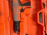 an orange case with a stapler and a stapler in it
