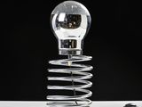 a light bulb that is sitting on top of a spring