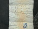 a receipt on the seat of a car with a picture of a bird on it