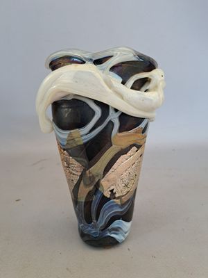 a vase with a black and white design on it