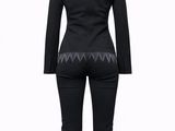 a woman in a black top and pants with long sleeves on a mannequin mannequin