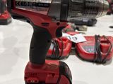 a corded drill that is connected to a charger