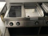 an image of a commercial kitchen with stainless steel appliances