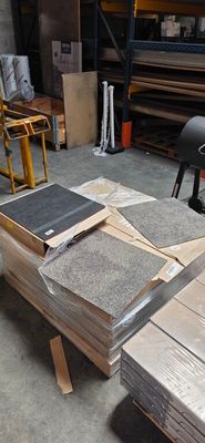 a pile of wood sitting on a table in a warehouse