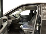 the interior of a car with the door open showing the driver ' s seat