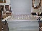 a table with a bunch of empty glasses on it