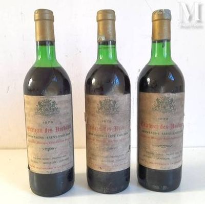 three bottles of wine sitting on top of a table next to each other