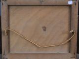 a picture of a wooden frame with a rope around it
