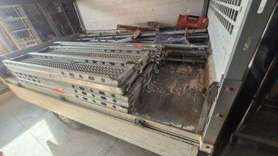 a lot of metal equipment that are sitting on the floor