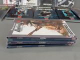 a lot of dvds sitting on a table together