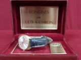 a watch in a box with a plaque on it