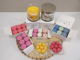 many candles that are sitting on a tray on the table