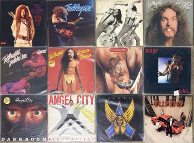 many different album covers on the wall of a room