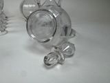 a lot of glass items that are on the table