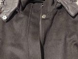 grey coat with a hood on a hanger on a white background