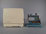 a small toy sewing machine and a small sewing machine