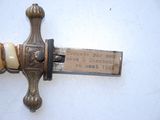 a sword that has a plaque on it