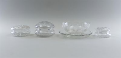 three glass objects sitting on a white surface