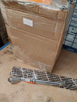 a box and a wrenet on the floor next to a cardboard box