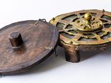 a small wooden box with a clock on top of it