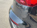 a close up of a car ' s tail light on the street