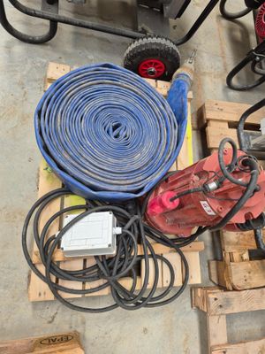 many different types of hoses and other tools on a pallet